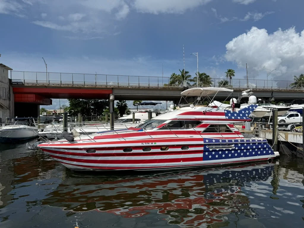 Capitán América yacht with its red, white, and blue wrap